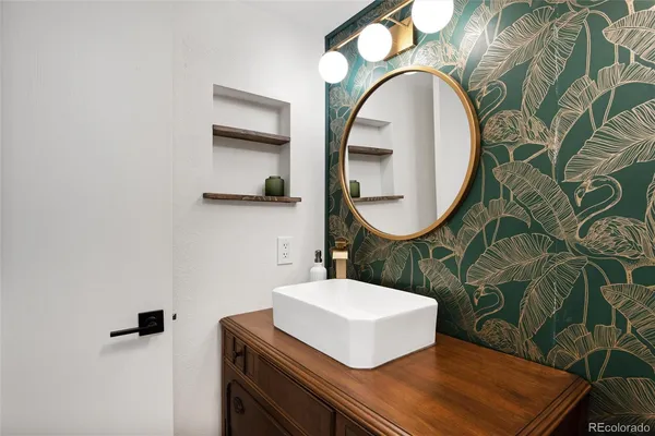 a bathroom with a sink and mirror