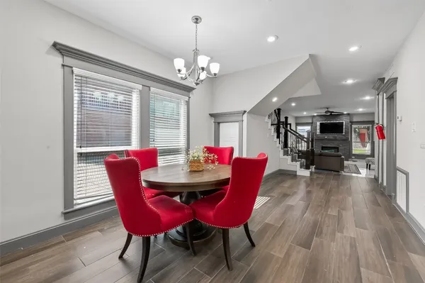 a view of a dining room with furniture window and wooden floor