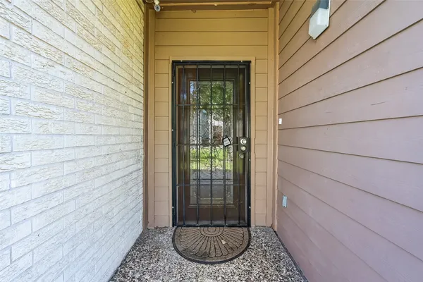 a view of a door and wooden floor
