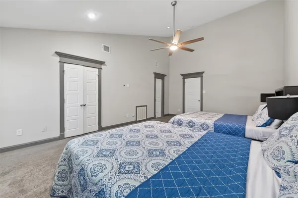 a bedroom with bed and a window