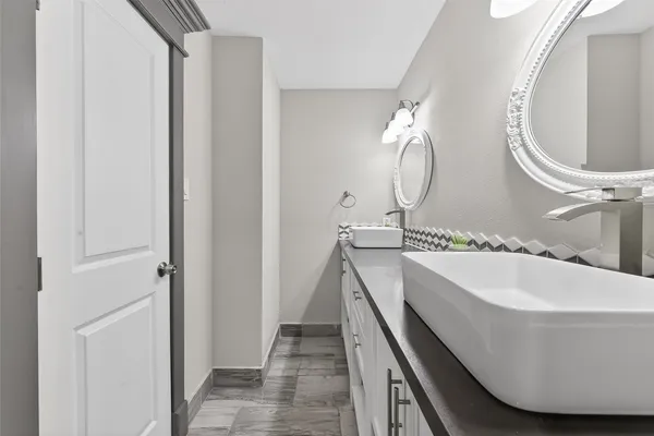 a bathroom with a sink and mirror