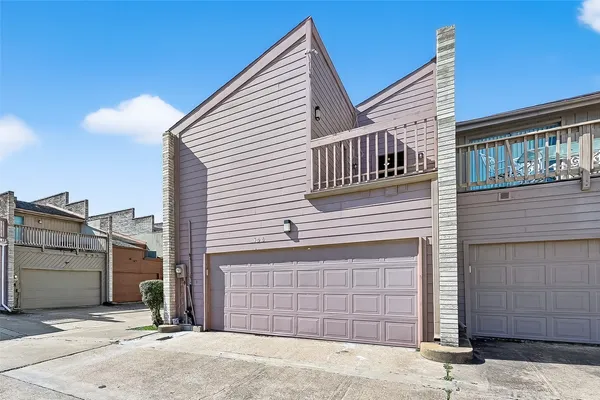 a view of a house with a garage