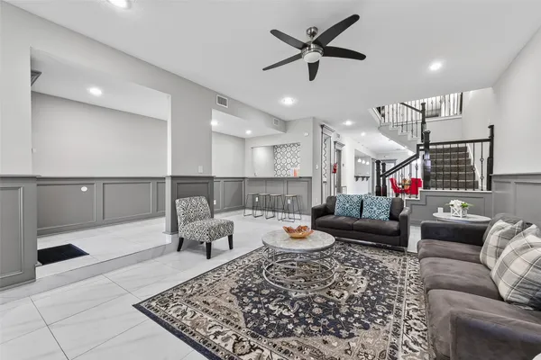 a living room with furniture and a rug
