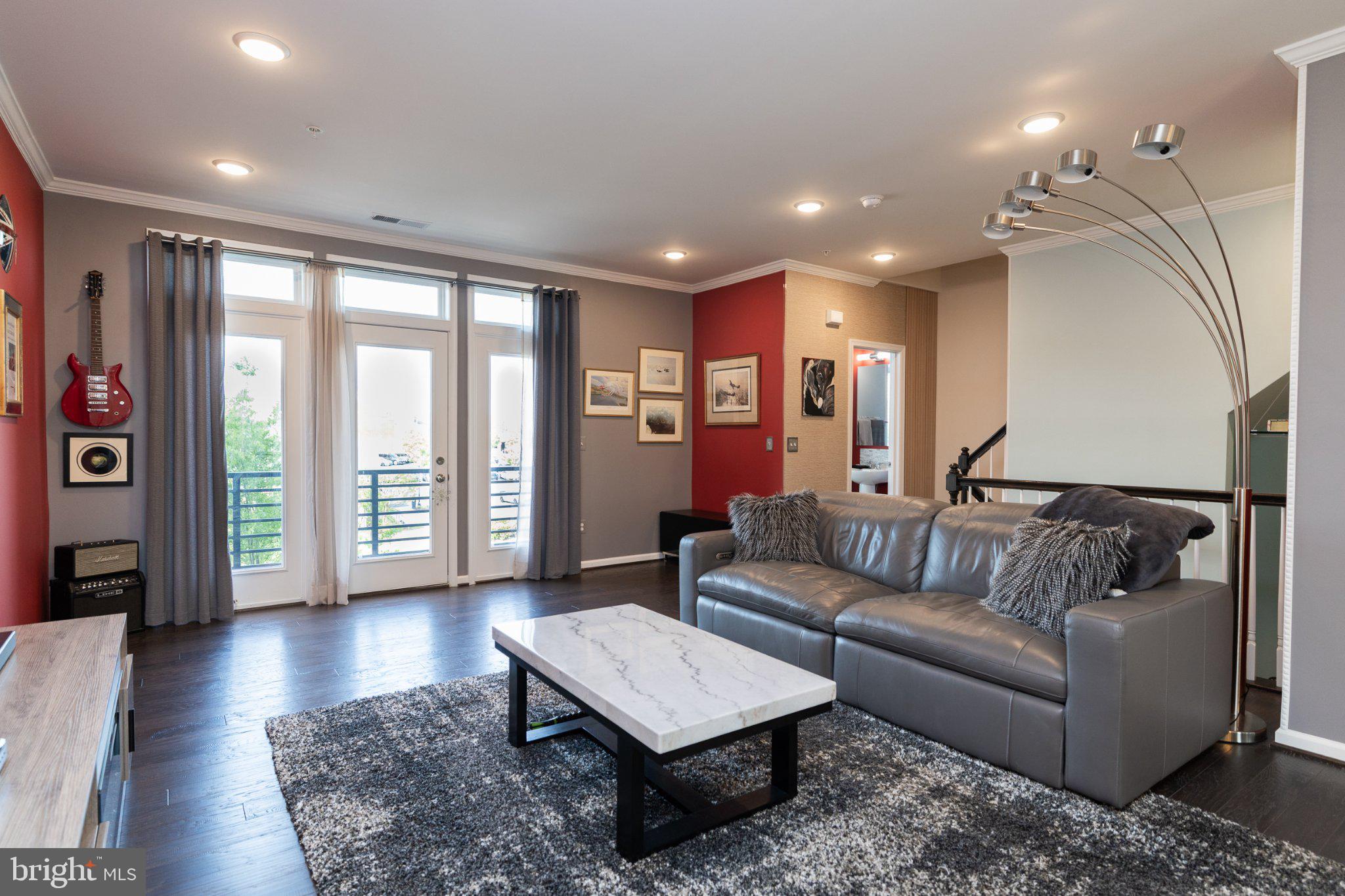 1414 Ribbon Limestone Terrace Southeast, Unit E204 Leesburg, VA 20175 - Photo 11 of 49 Modern living space with vibrant accents.