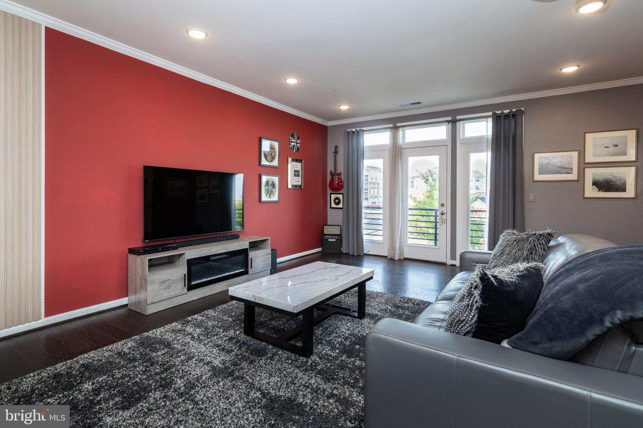 1414 Ribbon Limestone Terrace Southeast, Unit E204 Leesburg, VA 20175 - Photo 12 of 49 Modern living space with vibrant accents.