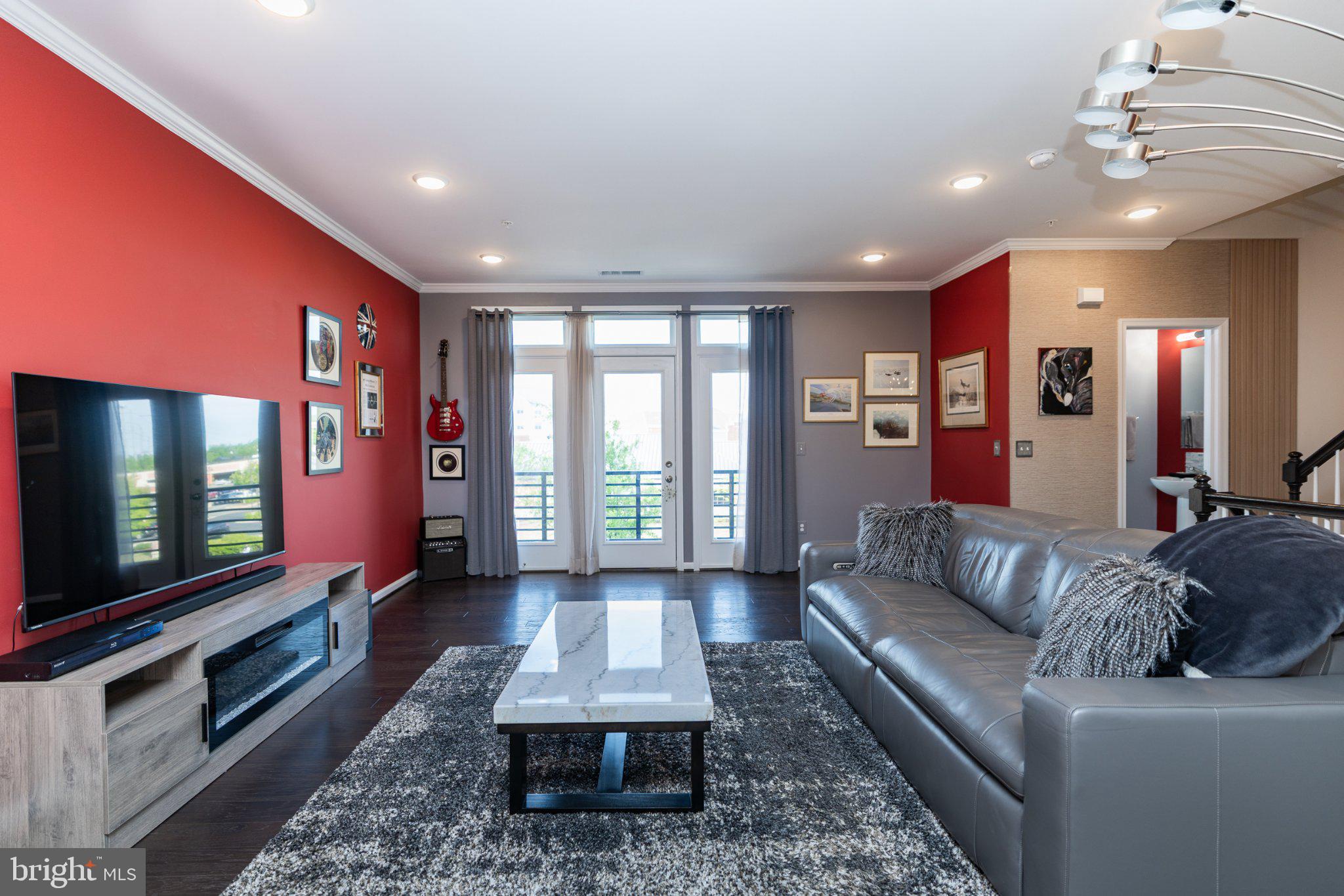 1414 Ribbon Limestone Terrace Southeast, Unit E204 Leesburg, VA 20175 - Photo 15 of 49 Modern living space with vibrant accents.