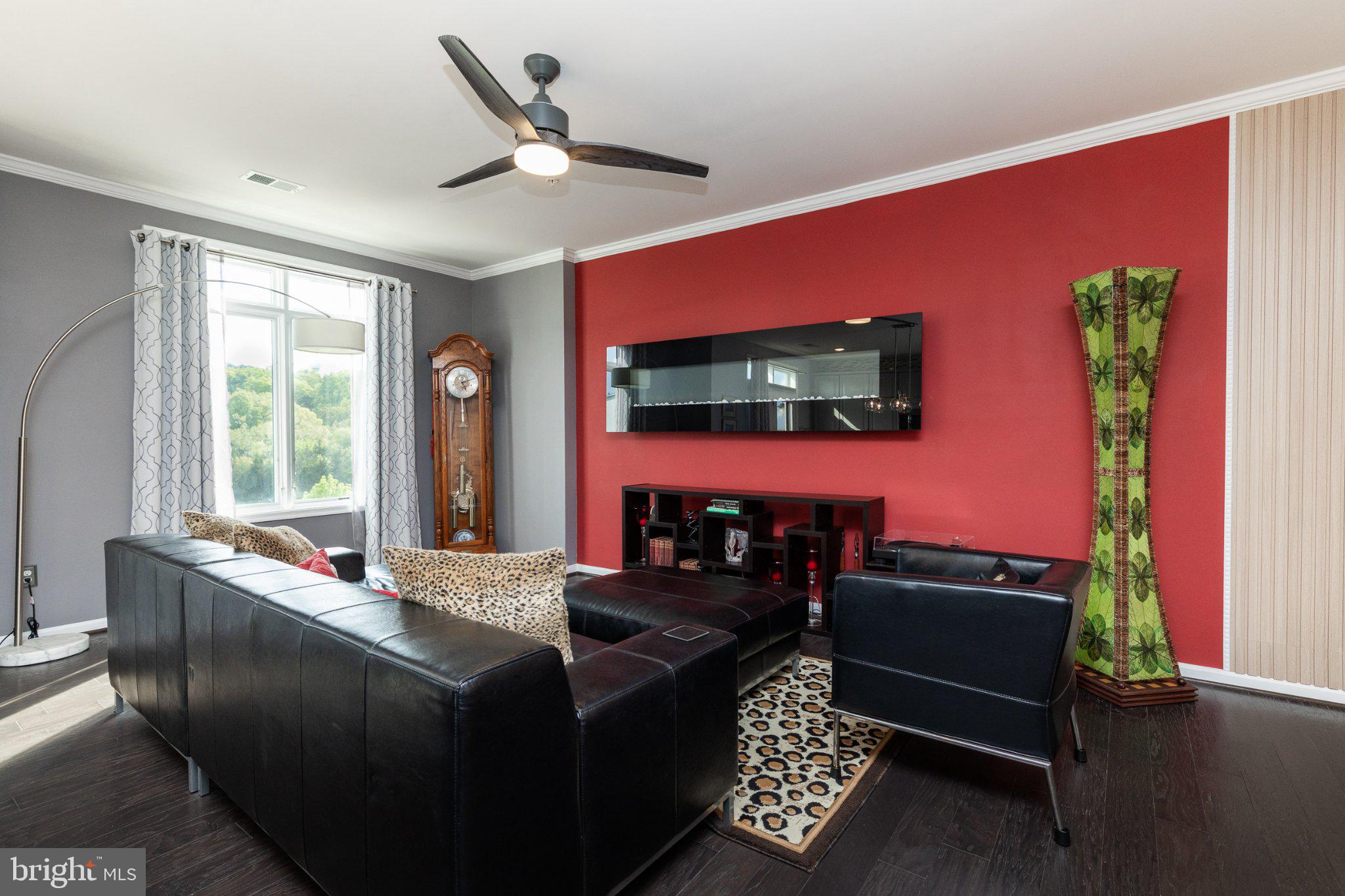 1414 Ribbon Limestone Terrace Southeast, Unit E204 Leesburg, VA 20175 - Photo 17 of 49 Modern living space with vibrant accents.