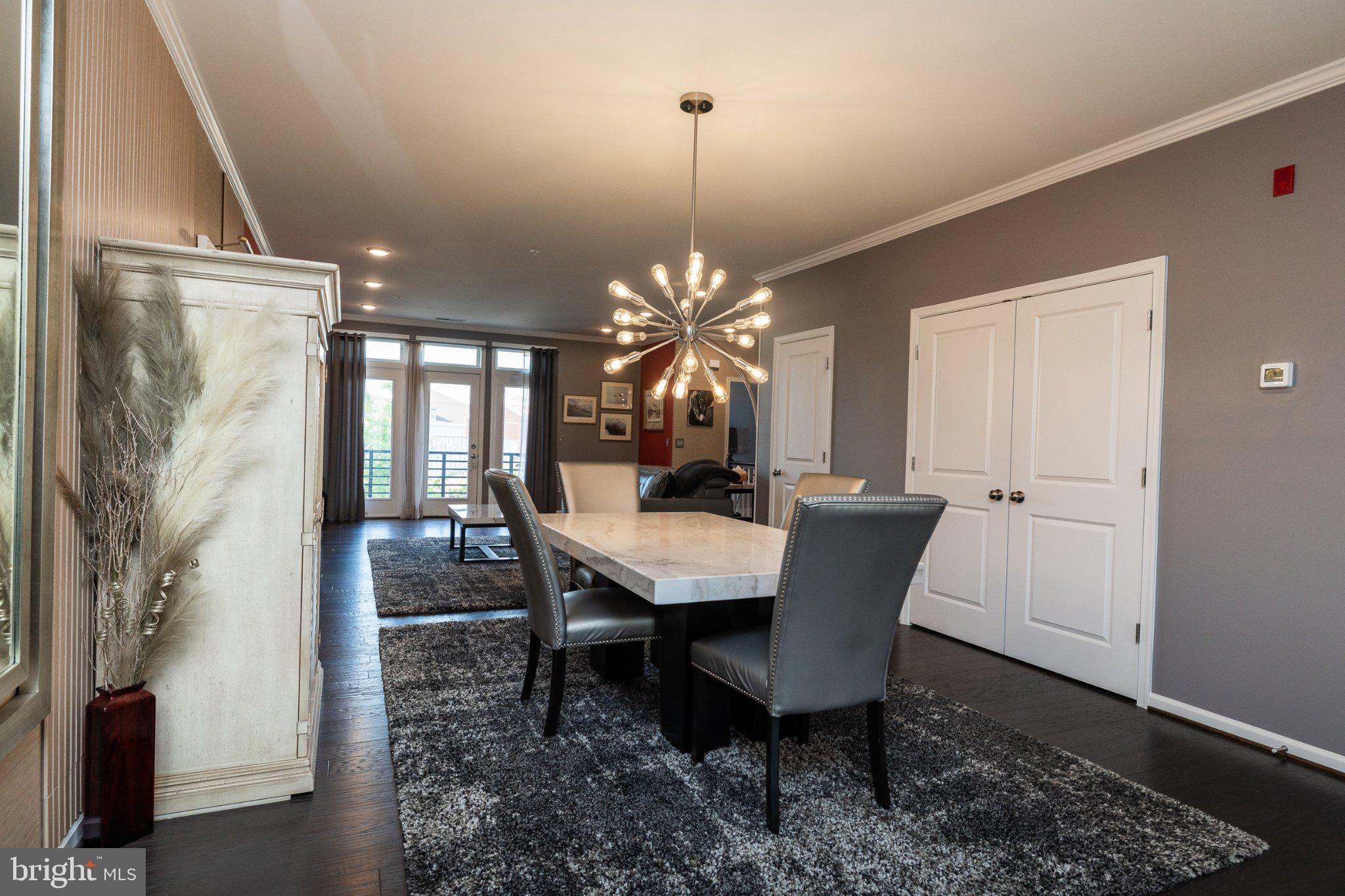 1414 Ribbon Limestone Terrace Southeast, Unit E204 Leesburg, VA 20175 - Photo 19 of 49 Modern elegance in a spacious dining area.