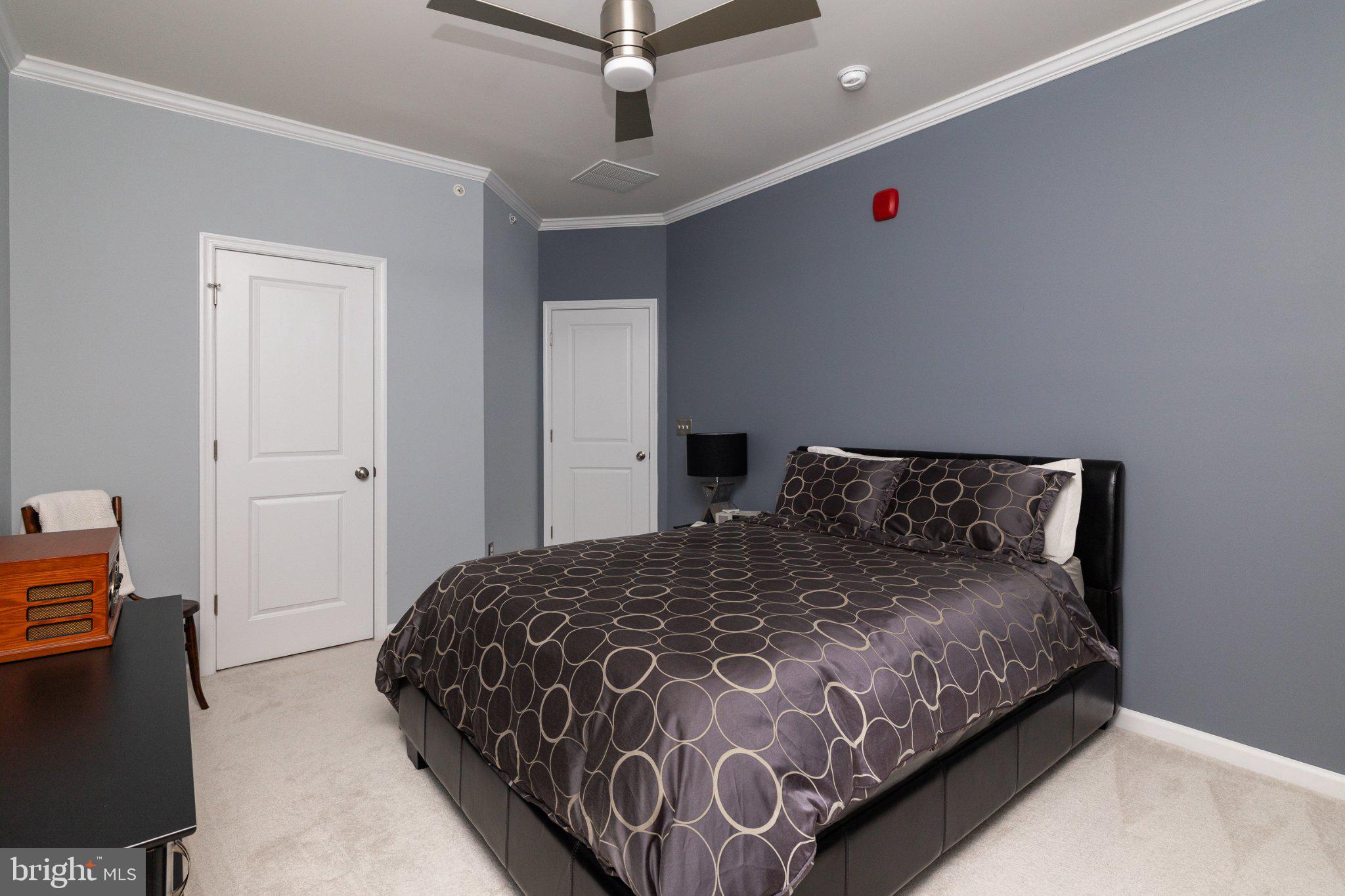 1414 Ribbon Limestone Terrace Southeast, Unit E204 Leesburg, VA 20175 - Photo 32 of 49 Modern bedroom with calming hues.