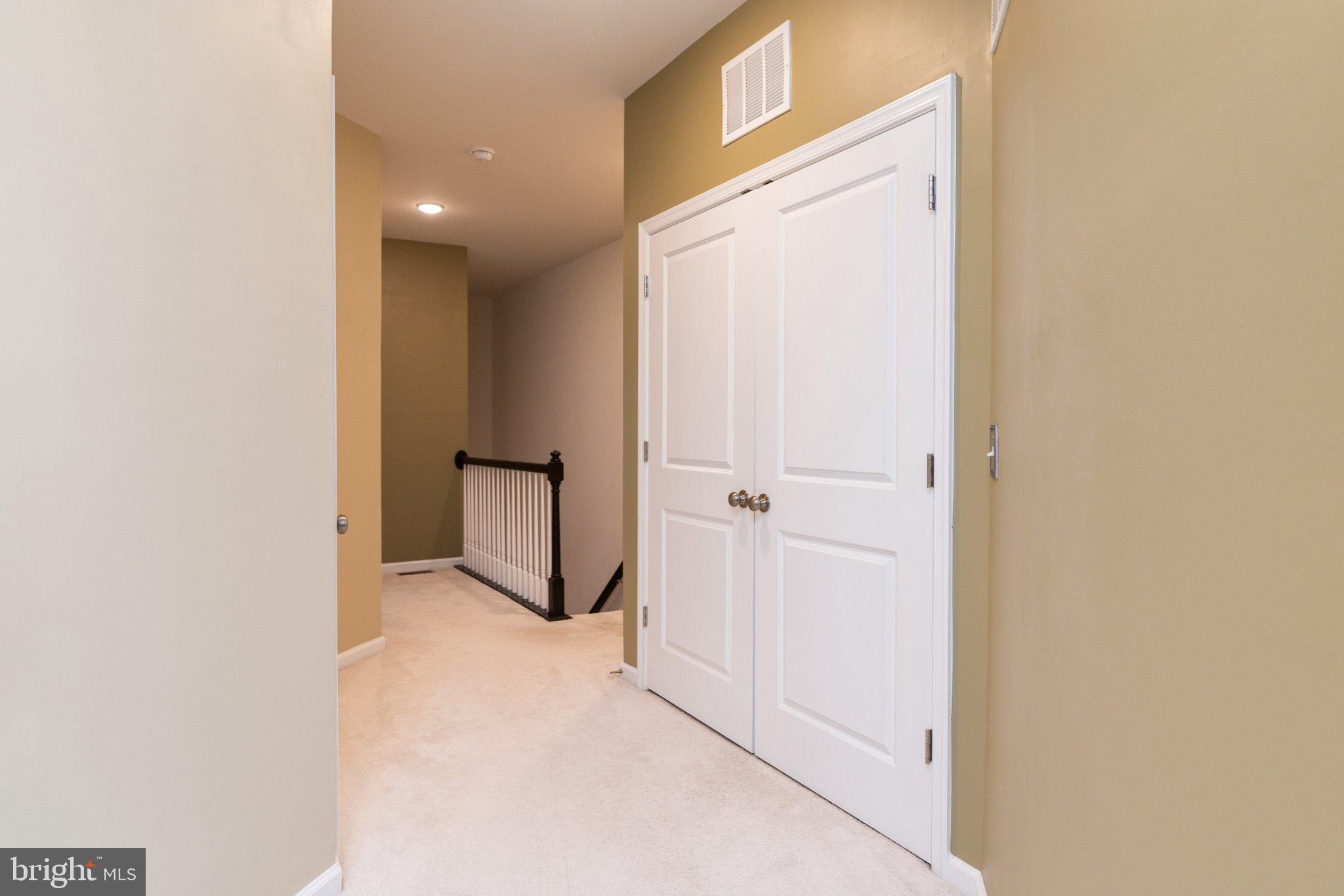 1414 Ribbon Limestone Terrace Southeast, Unit E204 Leesburg, VA 20175 - Photo 36 of 49 Inviting hallway with soft tones.