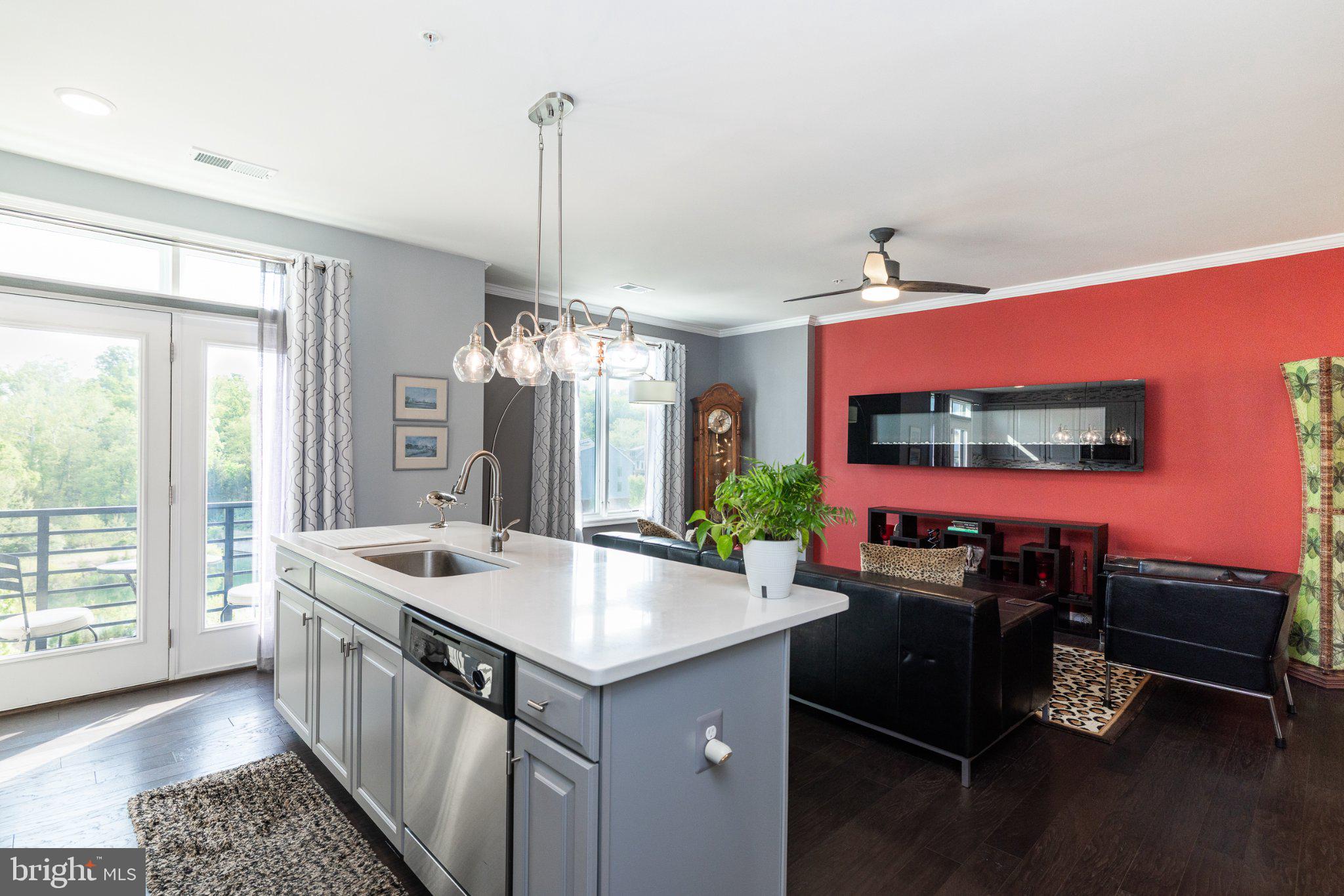 1414 Ribbon Limestone Terrace Southeast, Unit E204 Leesburg, VA 20175 - Photo 4 of 49 Modern open-concept living space.