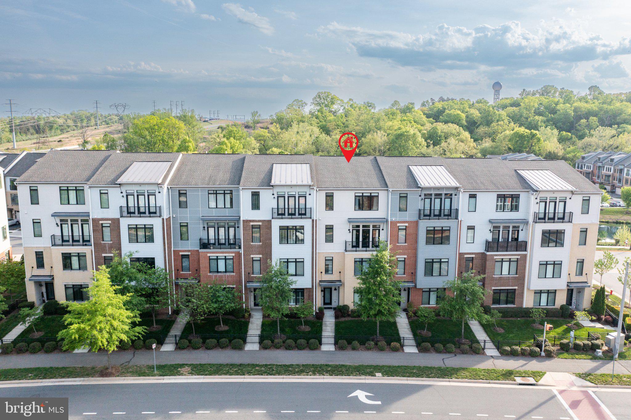1414 Ribbon Limestone Terrace Southeast, Unit E204 Leesburg, VA 20175 - Photo 48 of 49 Modern townhomes in a lush setting.
