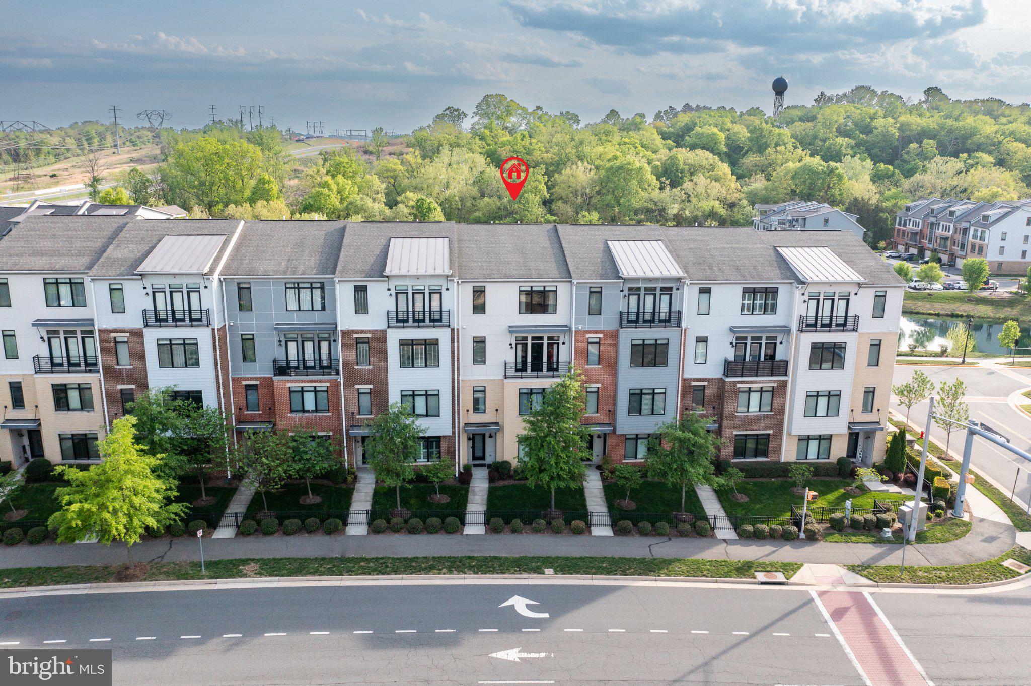 1414 Ribbon Limestone Terrace Southeast, Unit E204 Leesburg, VA 20175 - Photo 49 of 49 Modern townhomes in a lush setting.
