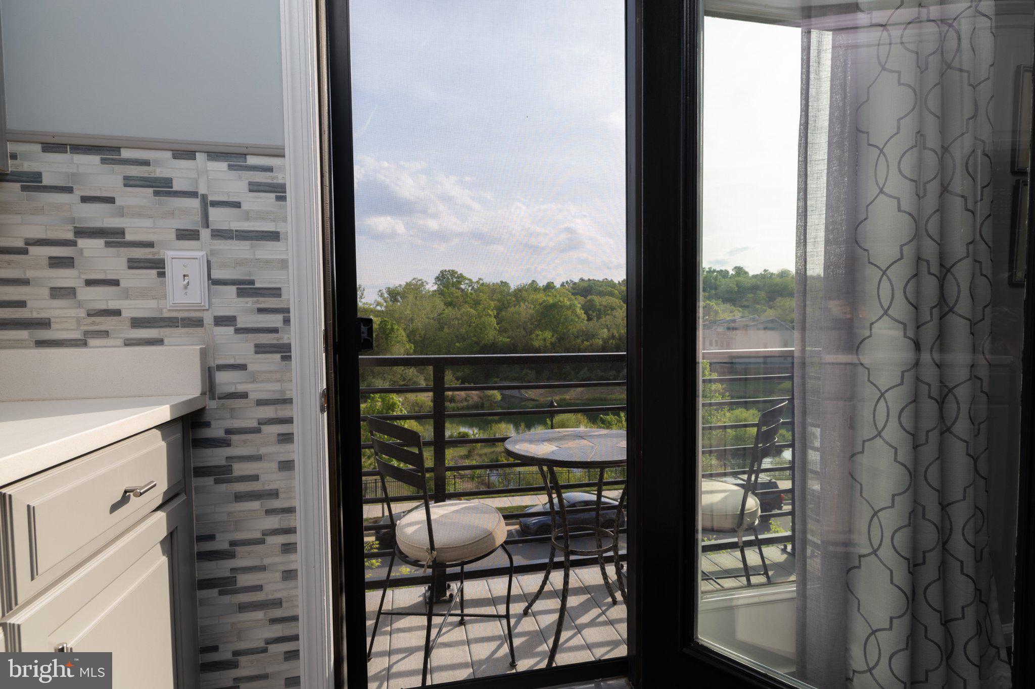 1414 Ribbon Limestone Terrace Southeast, Unit E204 Leesburg, VA 20175 - Photo 6 of 49 Serene balcony view awaits you.