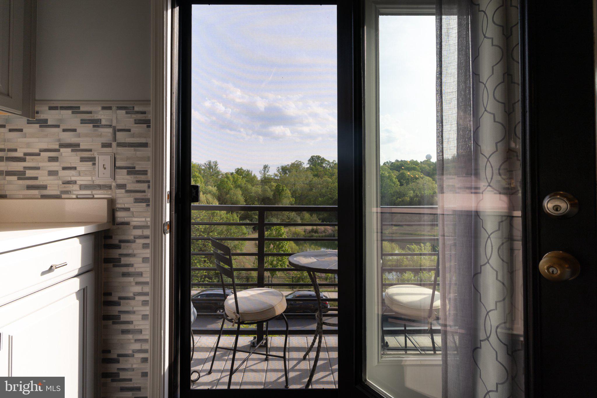 1414 Ribbon Limestone Terrace Southeast, Unit E204 Leesburg, VA 20175 - Photo 7 of 49 Serene balcony view awaits you.