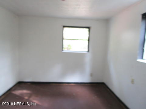 54057 Roy Booth Road Callahan, FL 32011 - Photo 8 of 10 an empty room with a window