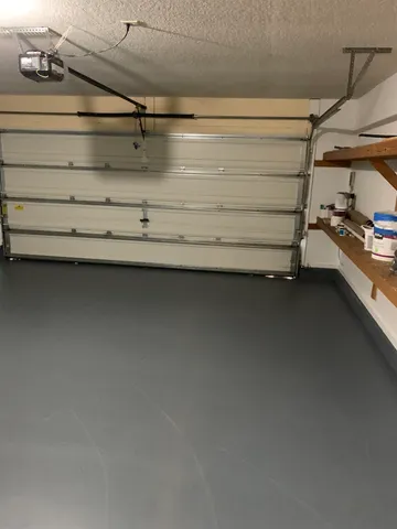 a view of a yard with wooden fence