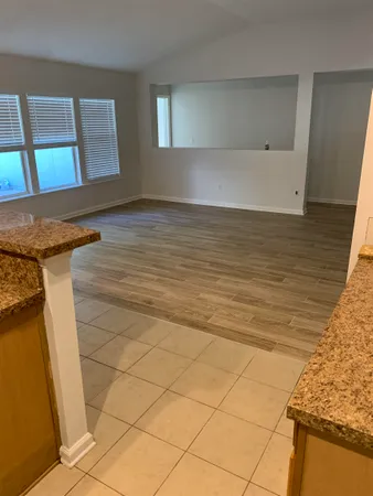 a kitchen with stainless steel appliances granite countertop a sink and a stove top oven