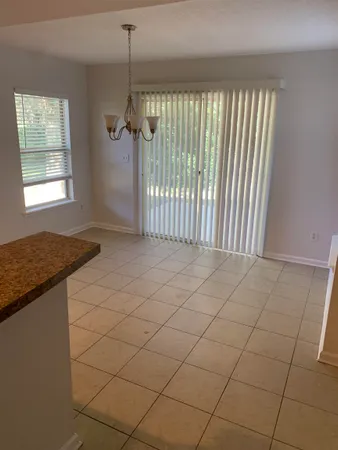 a kitchen with stainless steel appliances a stove a sink and a refrigerator