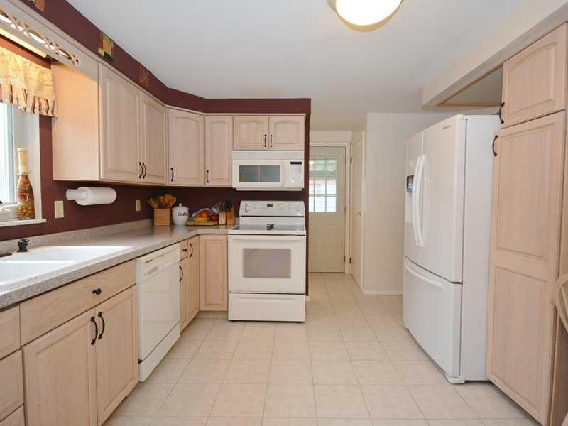 1305 Cathell Road Baldwin, PA 15236 - Photo 8 of 23 Kitchen. The equipped kitchen offers ceramic tile floor, Corian countertops, recessed lighting, patio access (via the door at the top center), and loads of work and storage space!