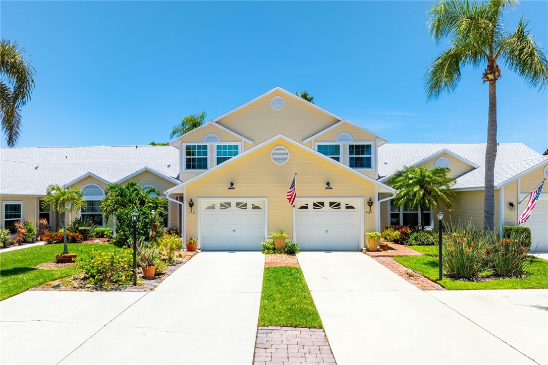 470 9th Place Vero Beach, FL 32960 - Photo 1 of 28 a front view of a house with a yard and potted plants