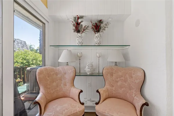 a couple of blue chairs sitting next to a window