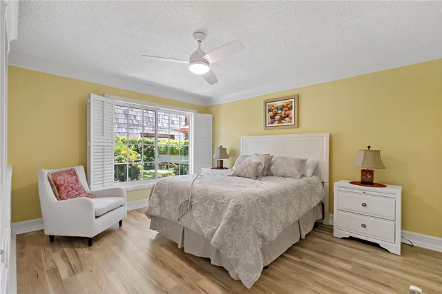 a spacious bedroom with a bed and a couch