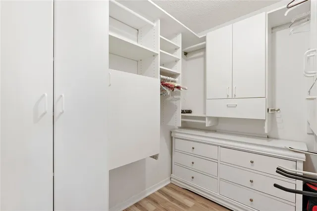 a view of cabinets a rug and a window in the kitchen