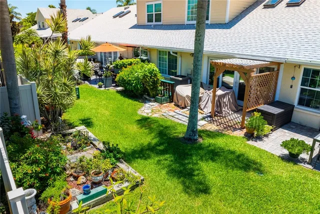 a view of a backyard with potted plants