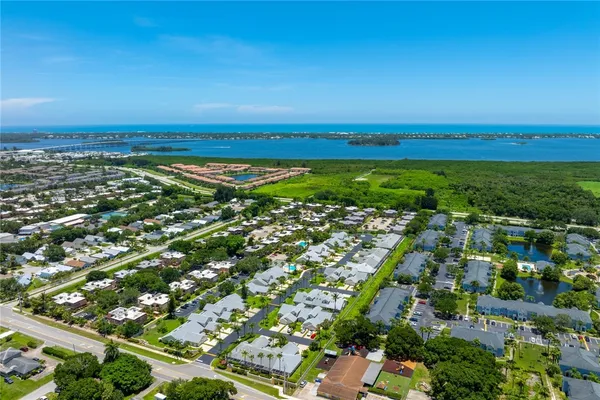 an aerial view of residential houses with outdoor space