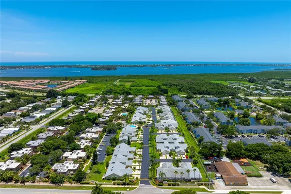 an aerial view of residential building and ocean