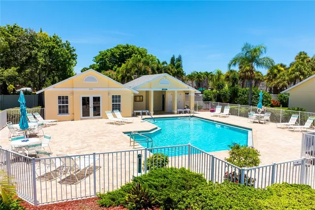 a front view of a house with yard and porch