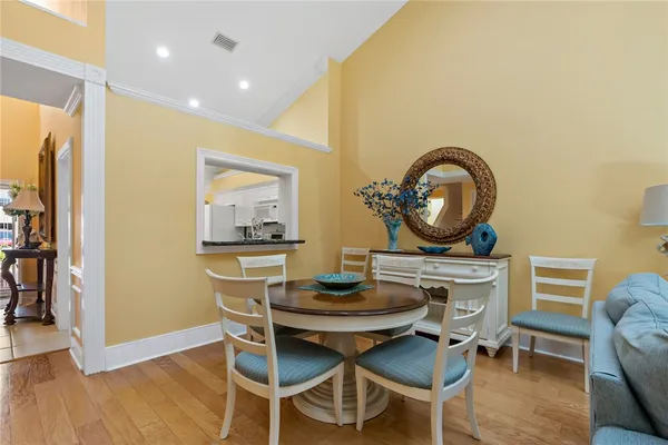 a view of a dining room with furniture and wooden floor