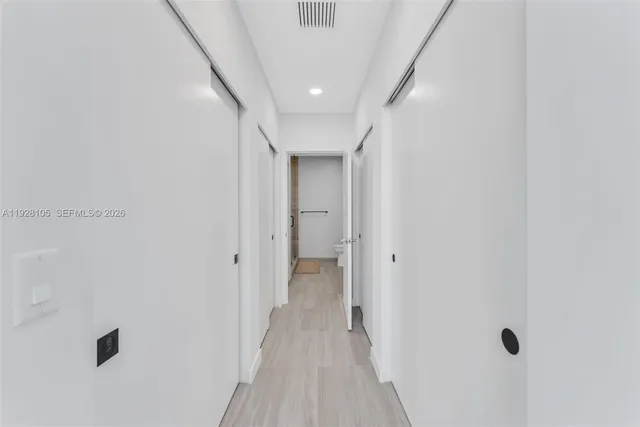 a building outdoor space with patio furniture and potted plants