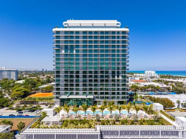 a balcony with table and chairs