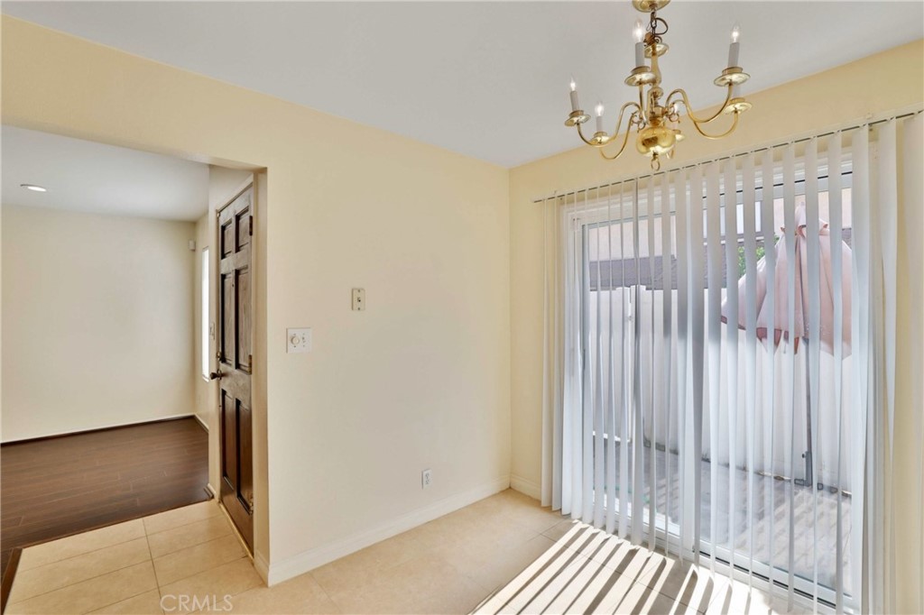 11557 Lower Azusa Road, Unit D El Monte, CA 91732 - Photo 16 of 38 a view of a hallway with a chandelier