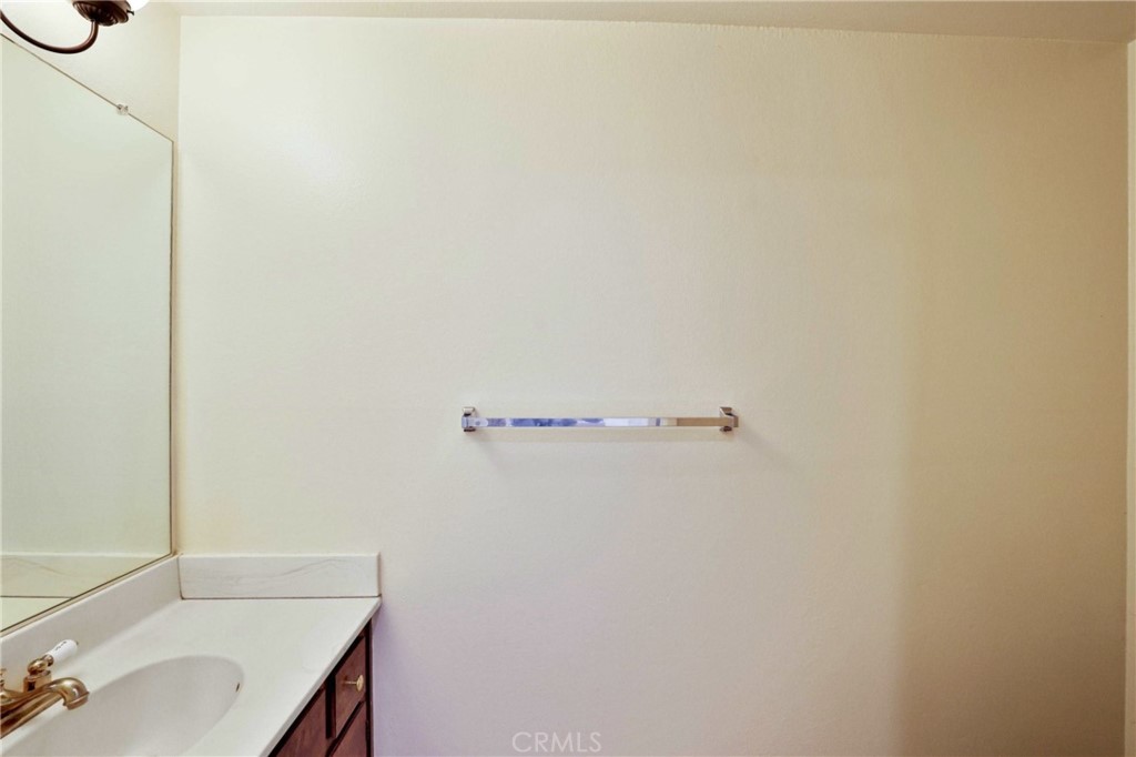 11557 Lower Azusa Road, Unit D El Monte, CA 91732 - Photo 17 of 38 a bathroom with a sink and a mirror