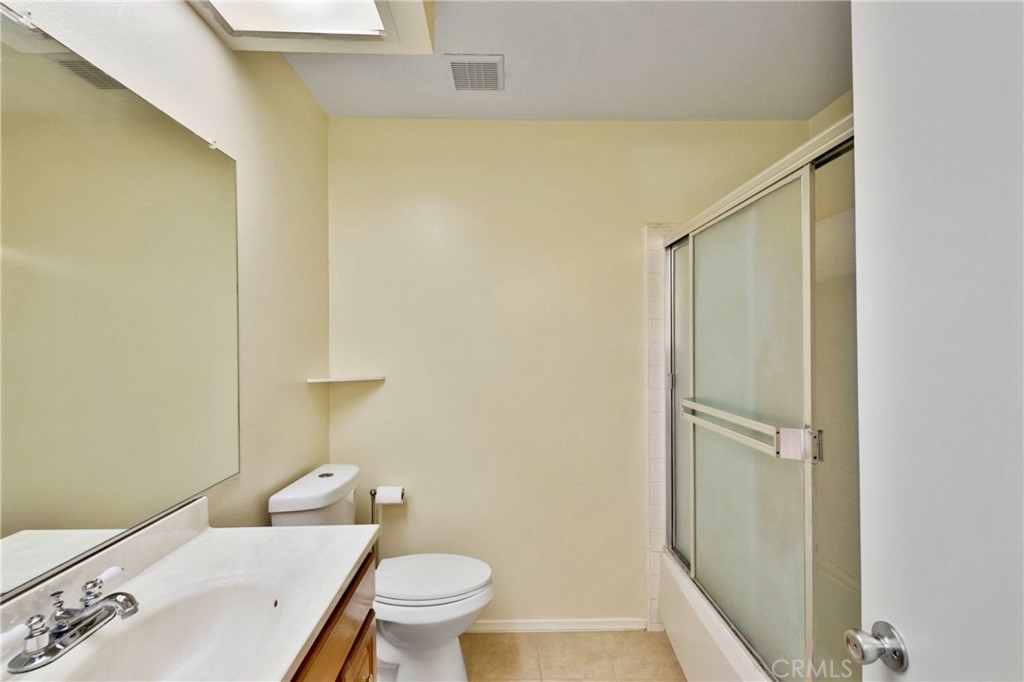 11557 Lower Azusa Road, Unit D El Monte, CA 91732 - Photo 27 of 38 a bathroom with a sink a toilet and shower