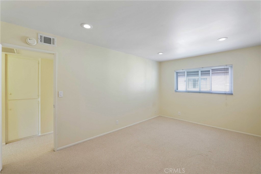 11557 Lower Azusa Road, Unit D El Monte, CA 91732 - Photo 28 of 38 an empty room with a empty space and windows
