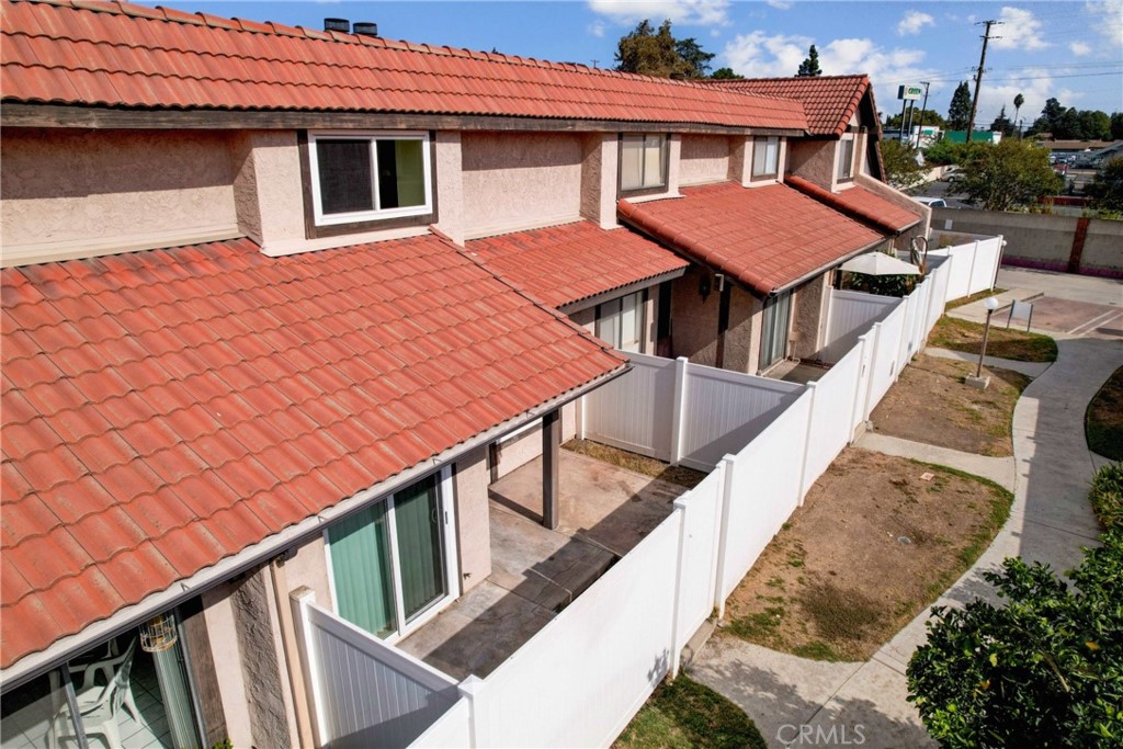 11557 Lower Azusa Road, Unit D El Monte, CA 91732 - Photo 32 of 38 a backyard of a house with wooden floor and fence