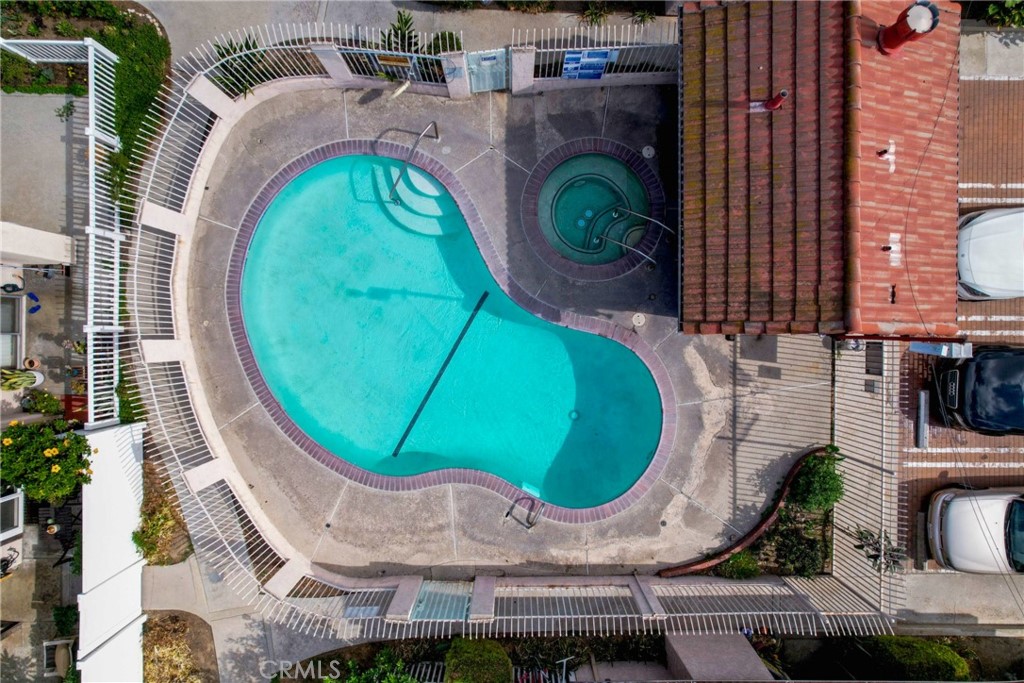 11557 Lower Azusa Road, Unit D El Monte, CA 91732 - Photo 34 of 38 an aerial view of a swimming pool with outdoor seating and a tub