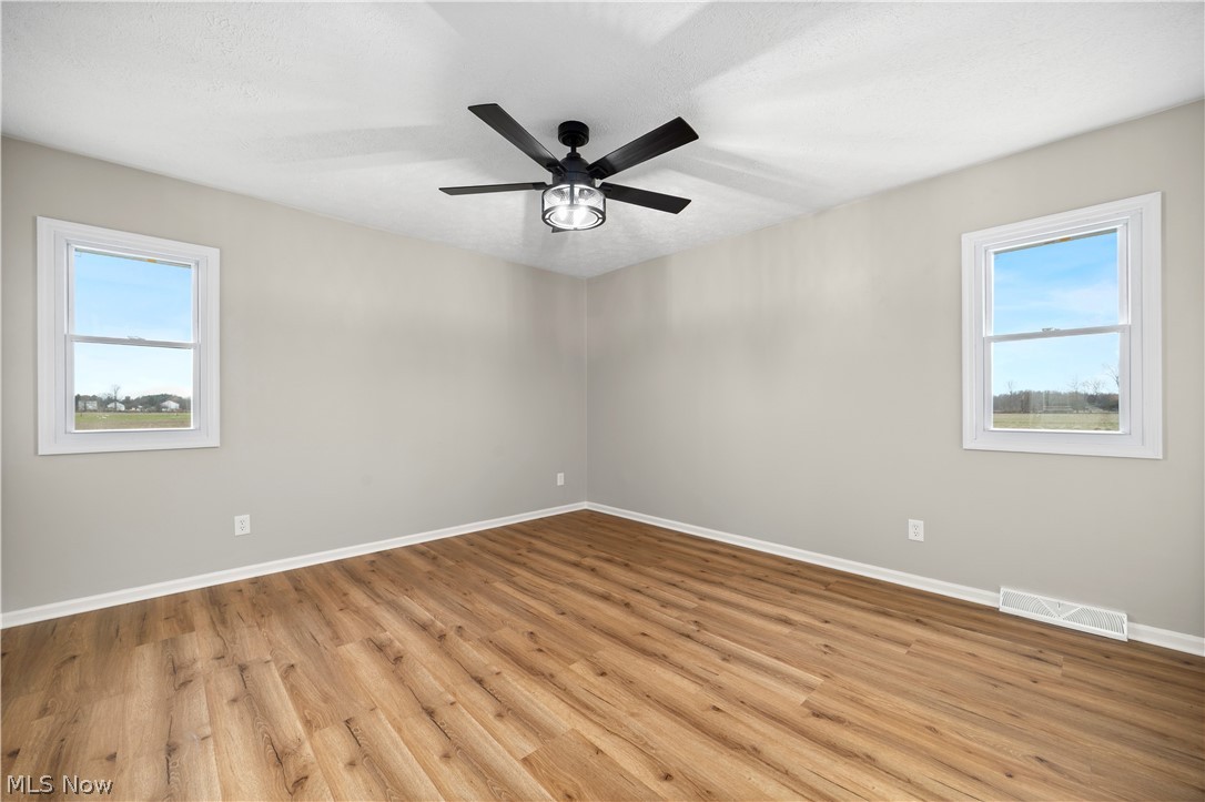 36220 Neff Road Grafton, OH 44044 - Photo 27 of 50 Spare room with light wood-type flooring and ceiling fan