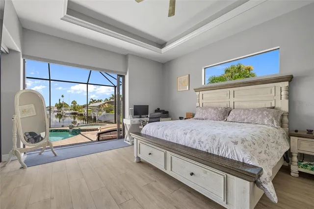 a bedroom with a bed and a balcony