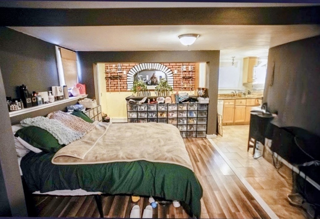 63 Wing Road Acushnet, MA 02743 - Photo 13 of 26 a bed sitting in a bedroom next to a window