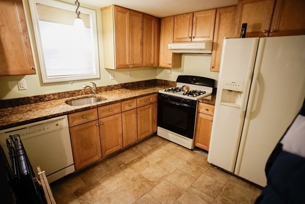 63 Wing Road Acushnet, MA 02743 - Photo 16 of 26 a kitchen with stainless steel appliances a refrigerator sink and cabinets
