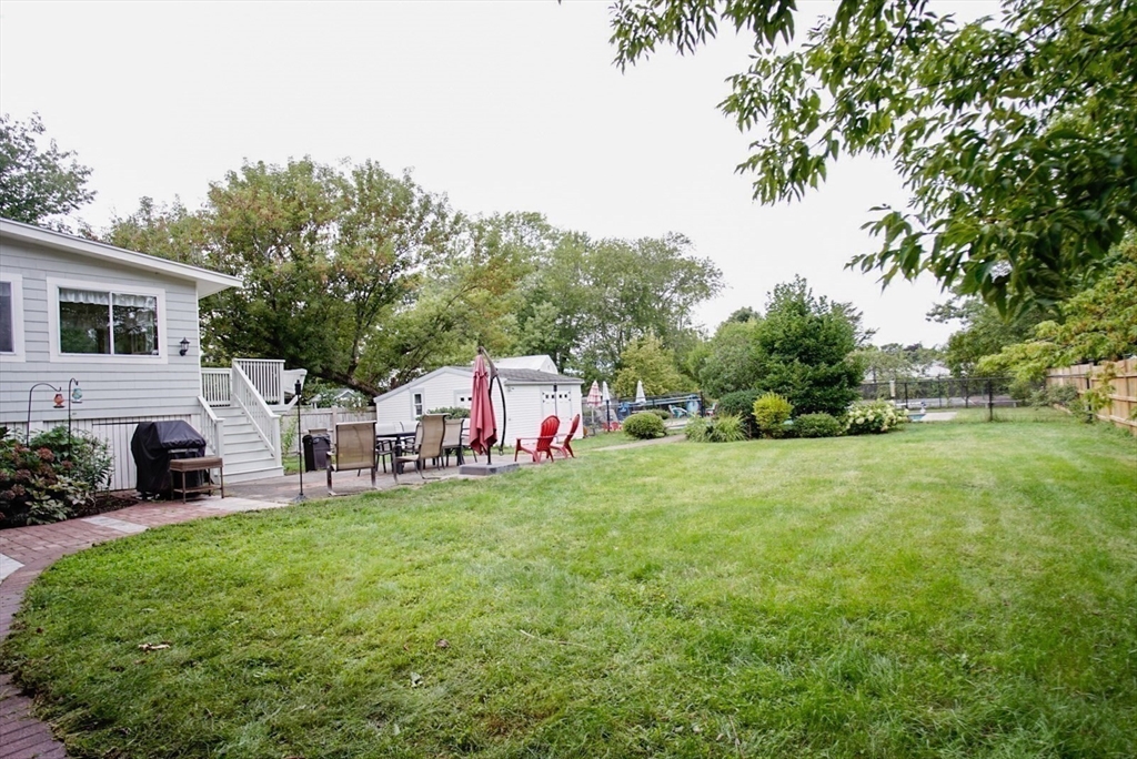 63 Wing Road Acushnet, MA 02743 - Photo 17 of 26 a house view with a sitting space and garden