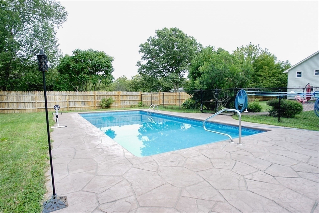 63 Wing Road Acushnet, MA 02743 - Photo 19 of 26 a view of a backyard with swimming pool