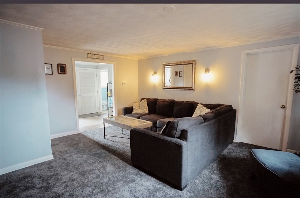 63 Wing Road Acushnet, MA 02743 - Photo 8 of 26 a living room with furniture and a window