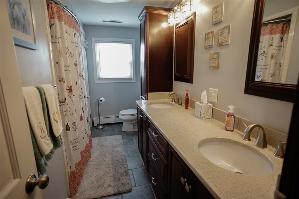 63 Wing Road Acushnet, MA 02743 - Photo 10 of 26 a spacious bathroom with a sink double vanity and a mirror
