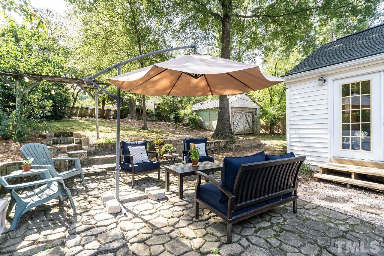 2715 Wayland Drive Raleigh, NC 27608 - Photo 24 of 30 an outdoor sitting area with furniture and wooden floor